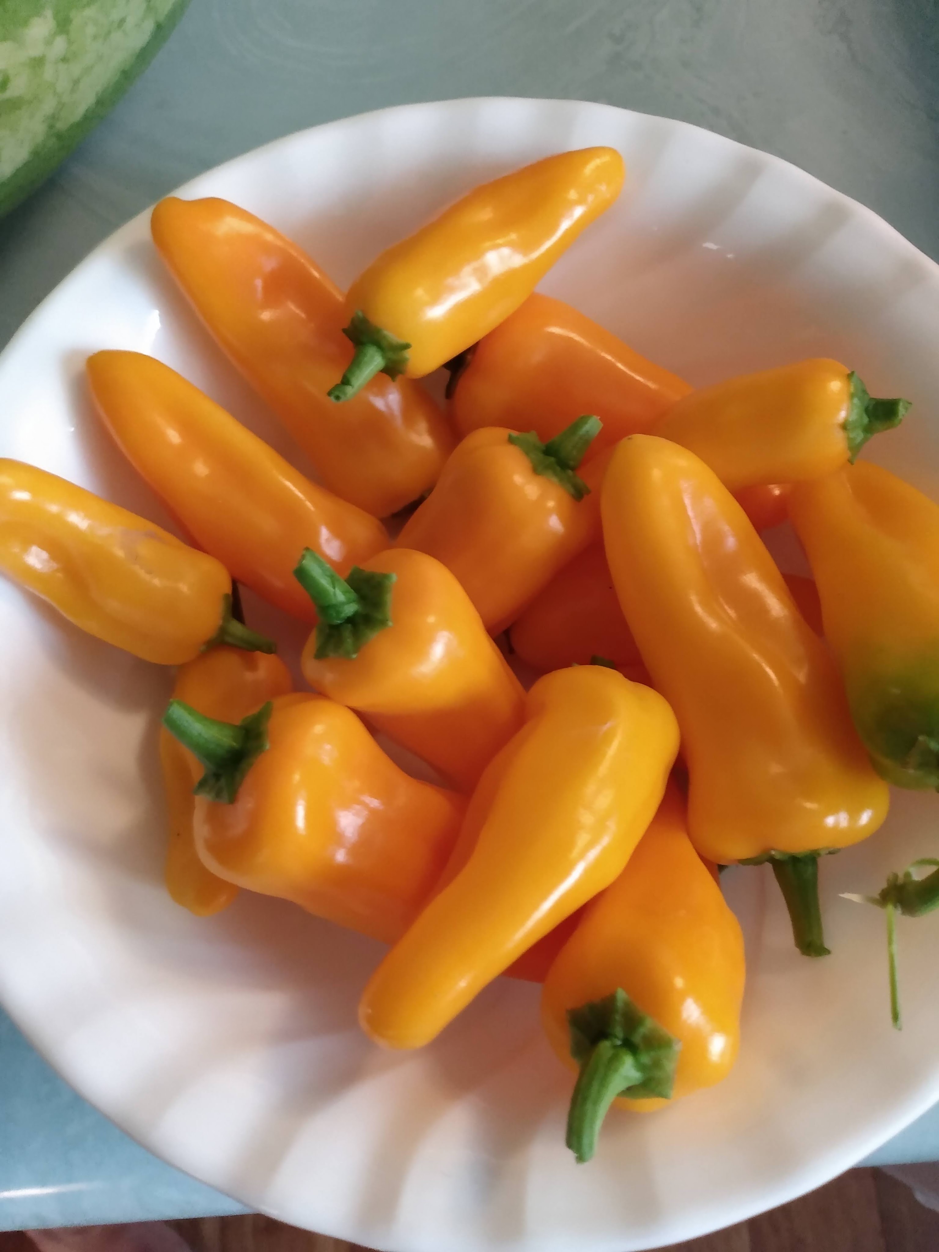 Bowl of small yellow peppers
